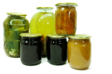 Canned vegetables and fruits in glass jars isolated on white background. 