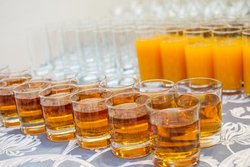 food background. many glasses with juice on buffet table