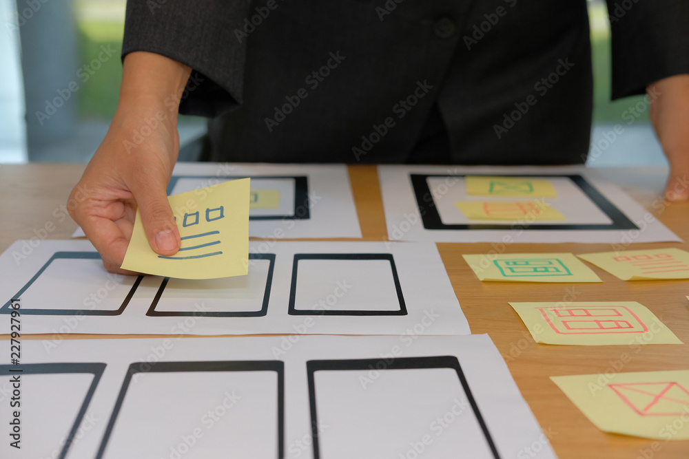 Wall mural user experience ux designer designing web on smartphone tablet layout. ui planning mobile applicatio