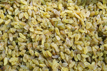 A large number of yellow raisins in the background  