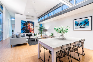 Living space shot during twilight in large luxurious Australian home with big artwork. Perth, Western Australia. Photo: October 2018.