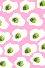 brussels sprouts texture on pink pastel background, vibrant mood food concept