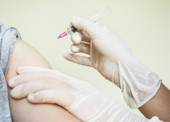 Doctor preparing a patient injection