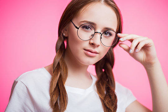 Close up portrait of a happy young teen girl in glasses