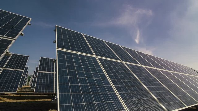 Solar panels tracking sunlight, time lapse