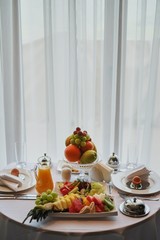 Delicious breakfast served for two at the hotel a white background. front view