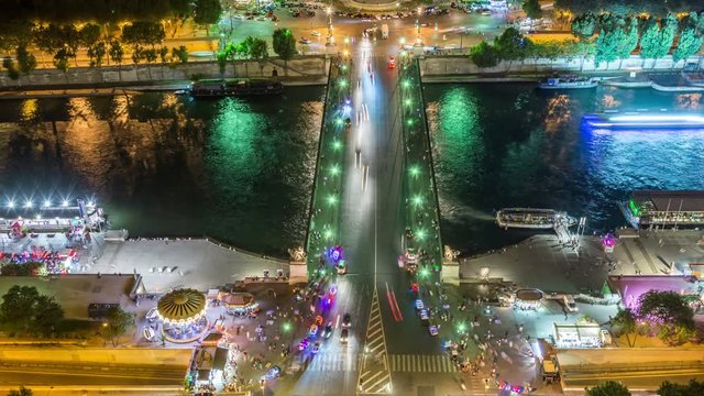 Aerial view on Jena Bridge (Pont d'Iena) at night, Seine river,Paris, France Bridge connects the Eiffel Tower on the left bank to the district of Trocadero on the right bank.