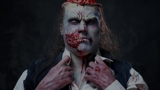 Scary zombie prostheric makeup on male model