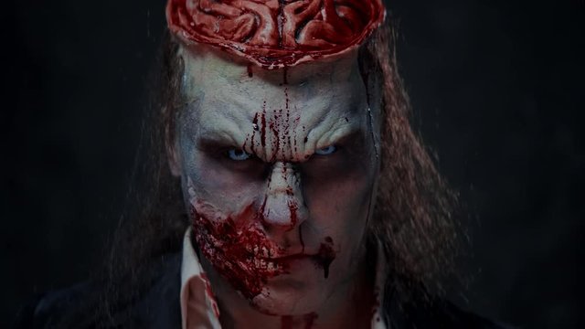 Scary zombie prostheric makeup on male model