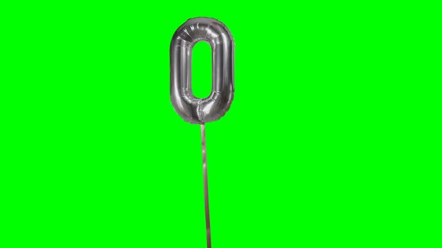 Number 0 zero helium silver balloon floating on green screen