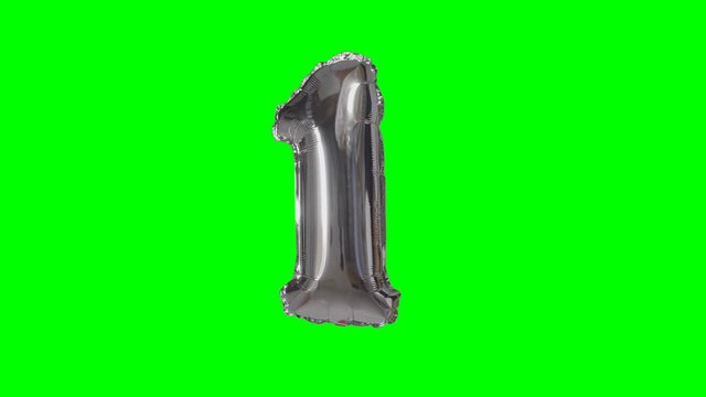 Number 1 one year birthday anniversary silver helium balloon floating on green screen