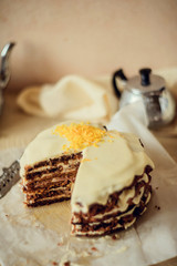 Homemade carrot cake on light background. The concept of autumn tea.