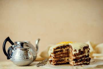 Homemade carrot cake on light background. The concept of autumn tea.