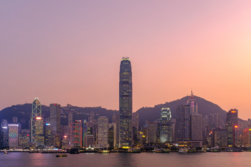 Fototapeta premium Hong Kong cityscape at sunset, long exposure photography for boat movement