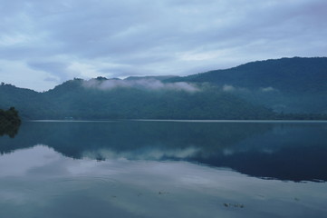 Fototapeta premium landscape of mountain with mist floating in lake