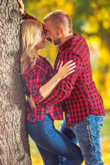 Young couple in love hugging and kissing.