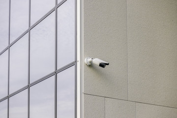 CCTV video camera security system on the wall of the building