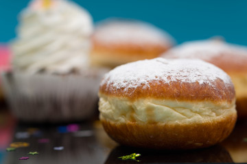 Cream bun drizzled with icing sugar