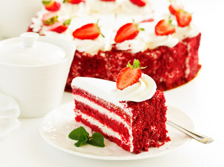 a piece of delicious red velvet cake on a plate.
