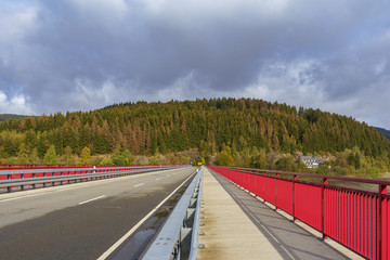 Fototapeta premium Bridge crossing the Okerstausee Okertalsperre reservoir in National Park Harz Germany