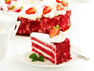 a piece of delicious red velvet cake on a plate.