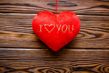 Fototapeta premium A symbol of love on brown background derevier 