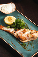 grilled salmon steak with vegetables and sauce