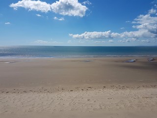 Beach landscape scene in Talybont, North Wales on a summer day.