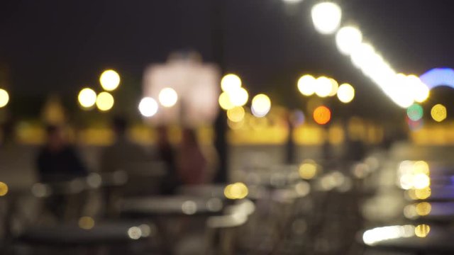 Blurred urban scene of outdoor cafe and people socializing