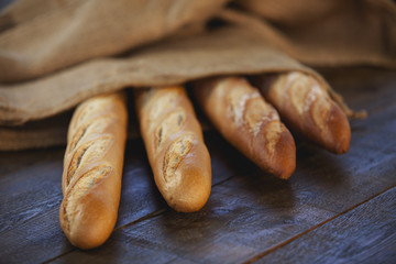 Rustic bread on wood background. Natural light