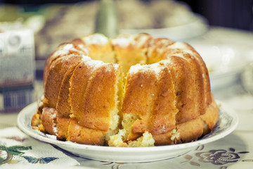 Homemade round cake with a powdered sugar