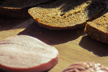 Sandwich of sliced .sausage on bread