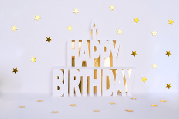 Lettering Happy birthday made from white paper