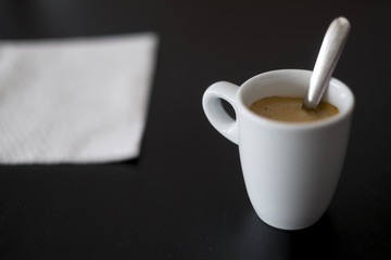 cup of coffee on a black table