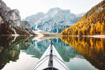 Kayak on a lake with mountains in the Alps