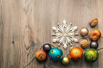 Fototapeta na wymiar Christmas decoration glass balls on a wooden background