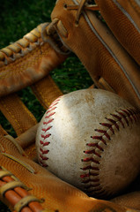 A Baseball Inside A Vintage Leather Baseball Glove