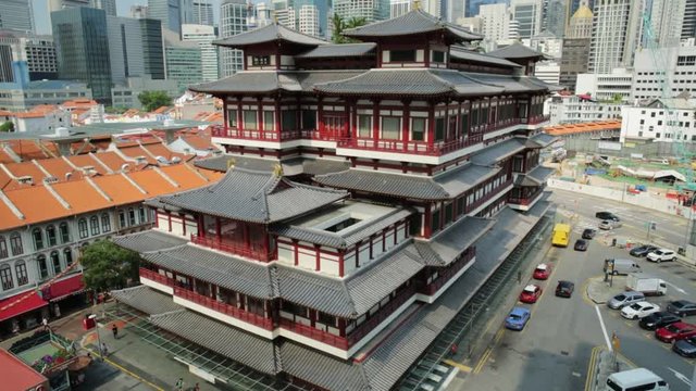 Buddha Tooth Relic Temple of Singapore from aerial view, Southeast Asia. Spectacular buddhist temple in Chinatown district with business district skyline.