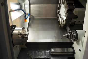 The CNC lathe machine or turning machine. Hi-technology manufacturing process.