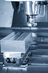The  CNC milling machine cutting the mold part with the face-mill tool.The hi-Technology manufacturing process.