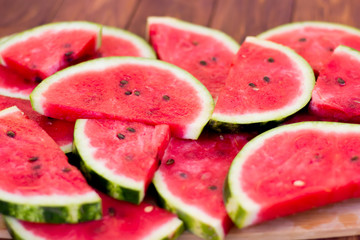 Fresh sliced watermelon wooden background