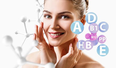 Young woman with vitamins balls near face and molecules chain.