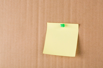 Fototapeta premium Post-It Note and Push Pin on Yellow