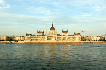 Naklejka premium Hungarian Parliament Building in the evening at the Danube river in Budapest, Hungary