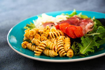 tasty fusilli pasta Italian meat sauce pasta on the table