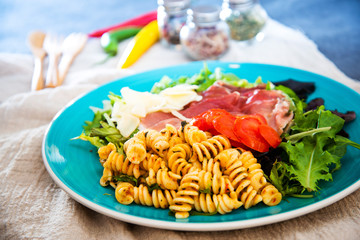 tasty fusilli pasta Italian meat sauce pasta on the table