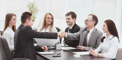 business partners shaking hands after a successful transaction