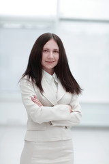 portrait of young business woman on office window background