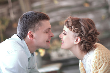 loving couple teasing each other in a stylish living room