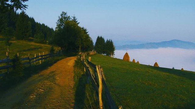 Rural scenery with haystacks and grassland. Romania, cca. 2010.